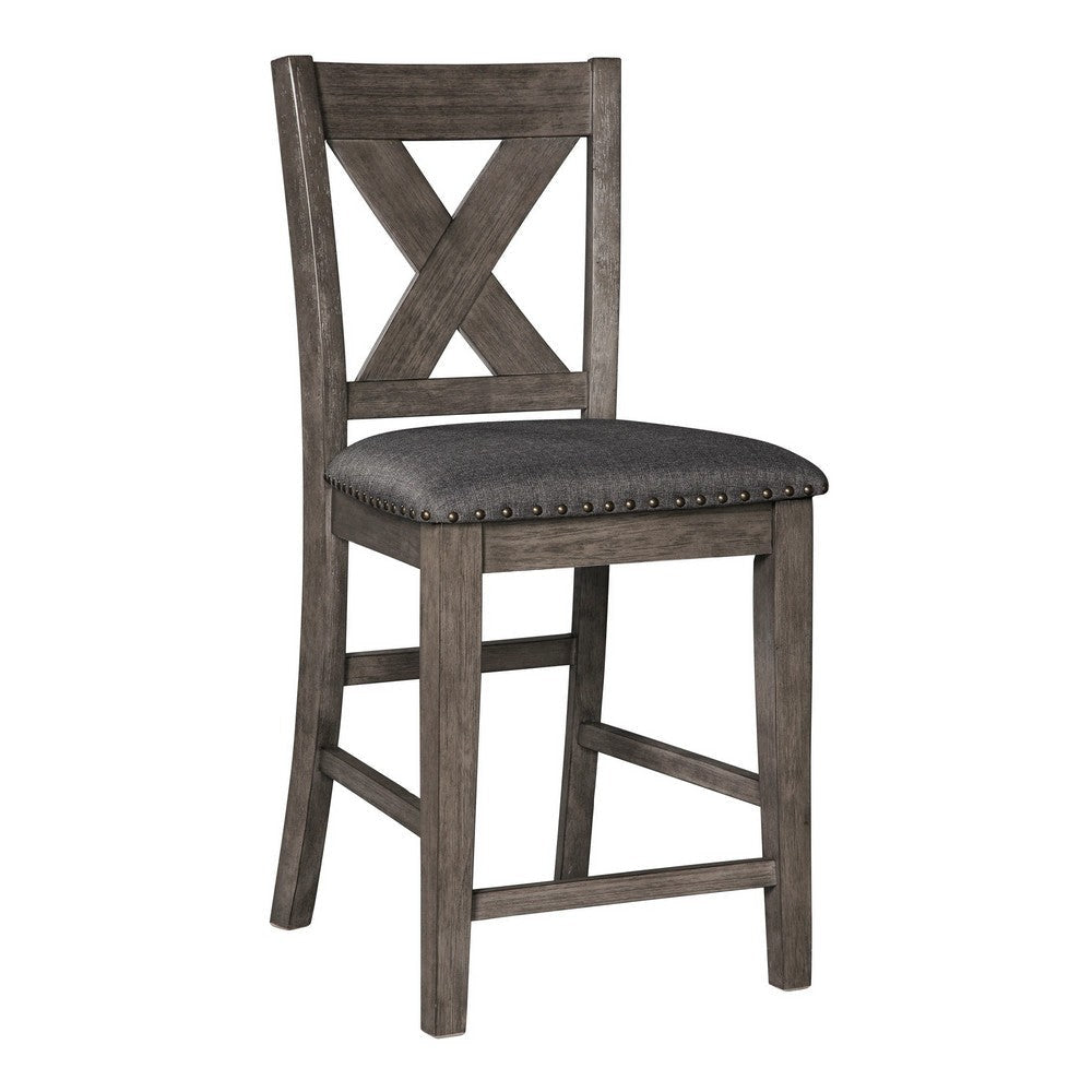 Close-up of a gray wood barstool with a lattice back and upholstered seat